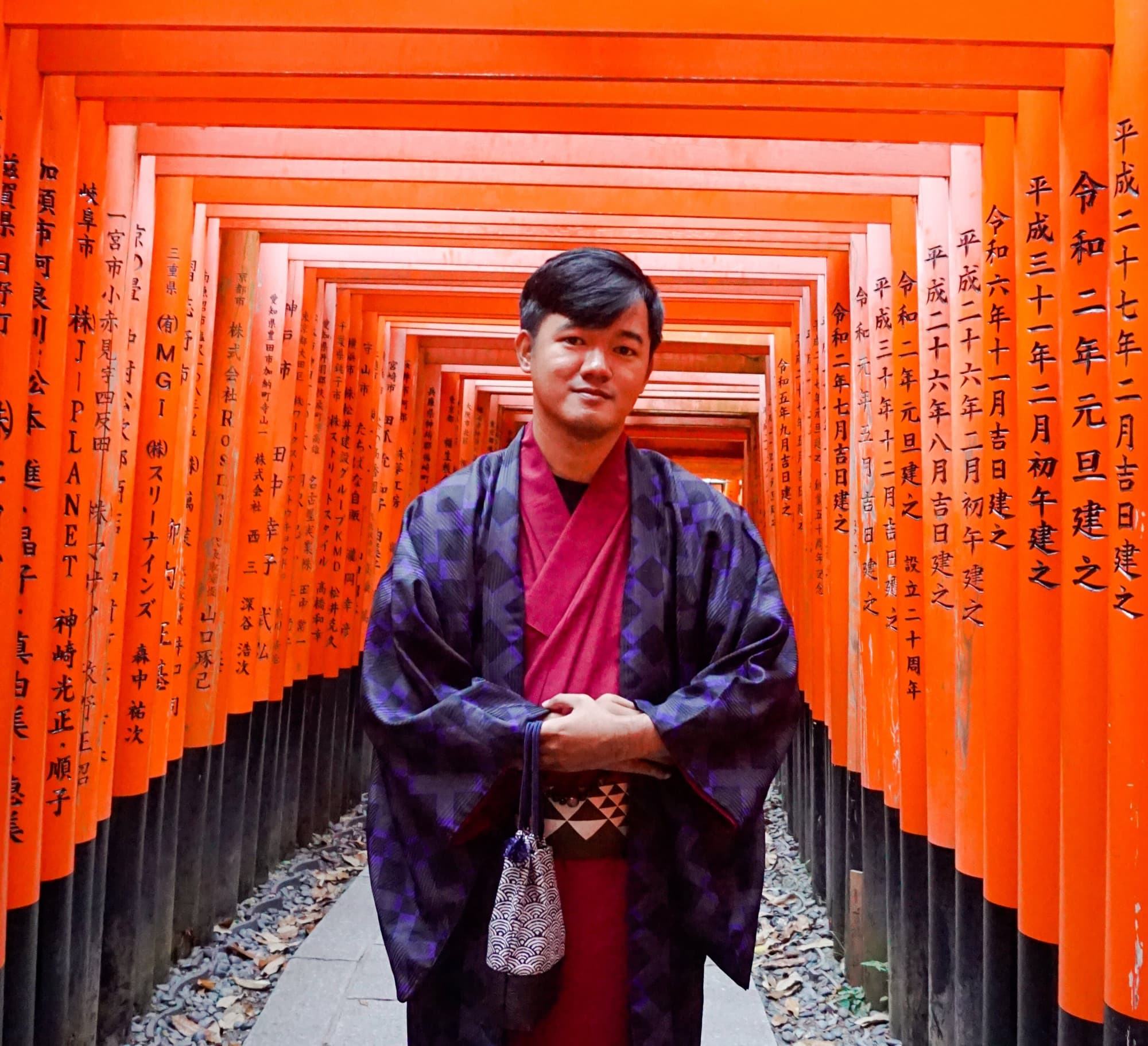 Agung in a kimono in the torii corridor at Fushimi Inari, Kyoto
